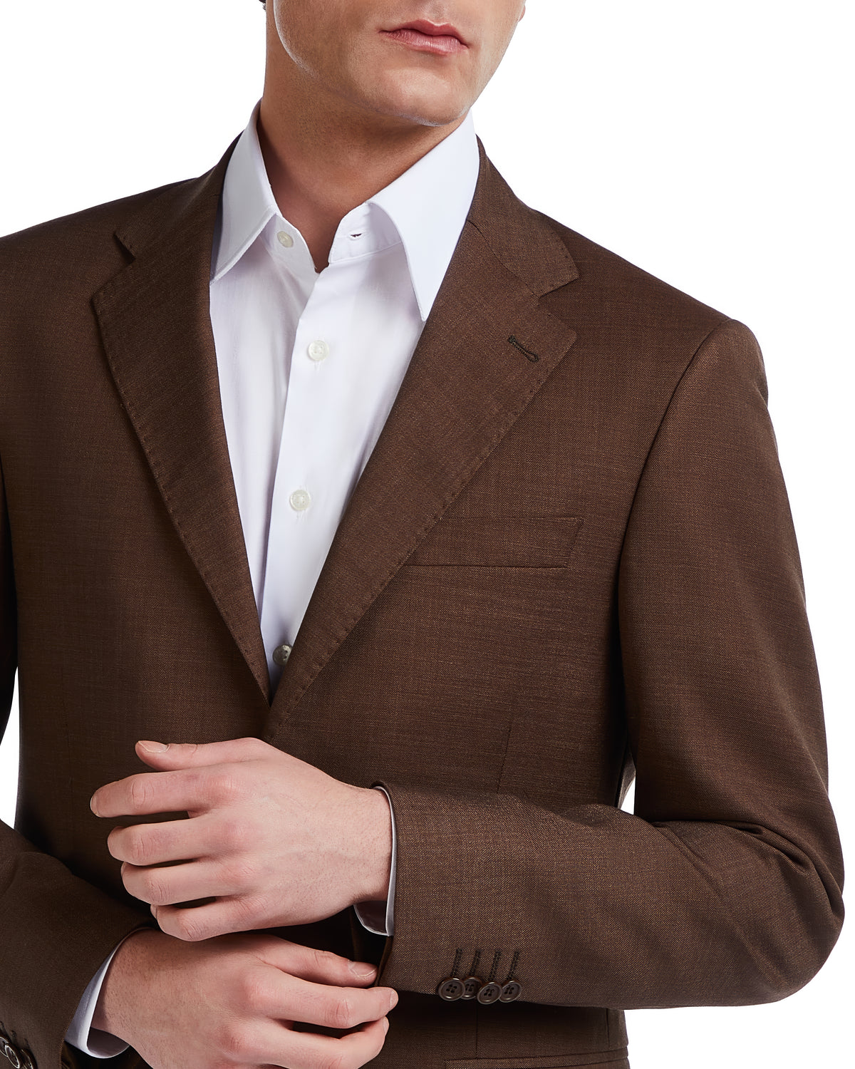 Brown textured blazer with notch lapels and buttoned cuffs, paired with a crisp white dress shirt.