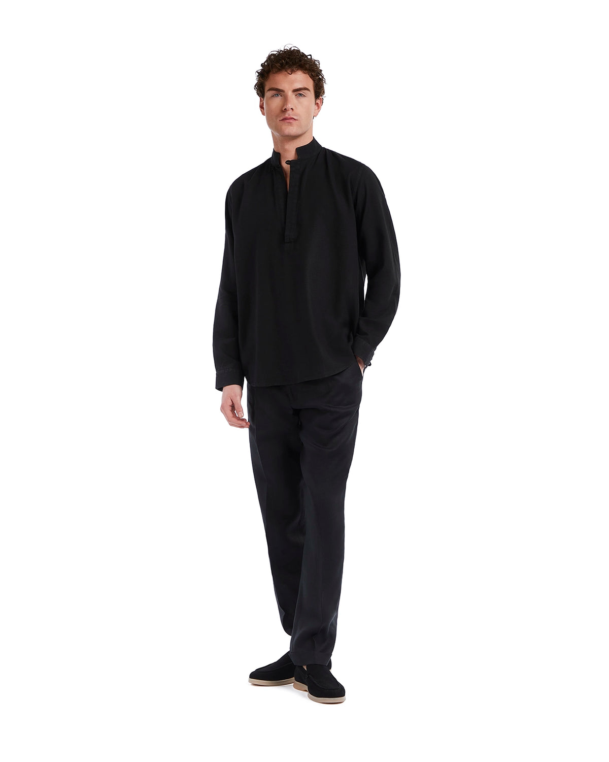 Men's black cotton pullover with a mandarin collar, paired with black trousers and stylish slip-on shoes.