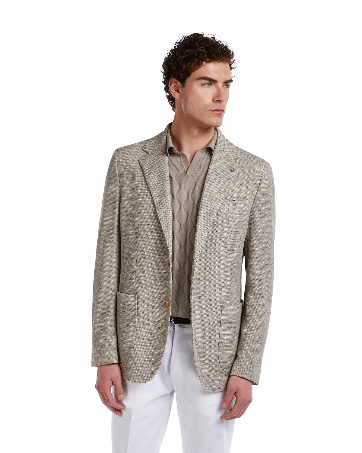 Men's beige textured blazer, tailored fit, lightweight fabric, paired with a light gray patterned shirt and white trousers.