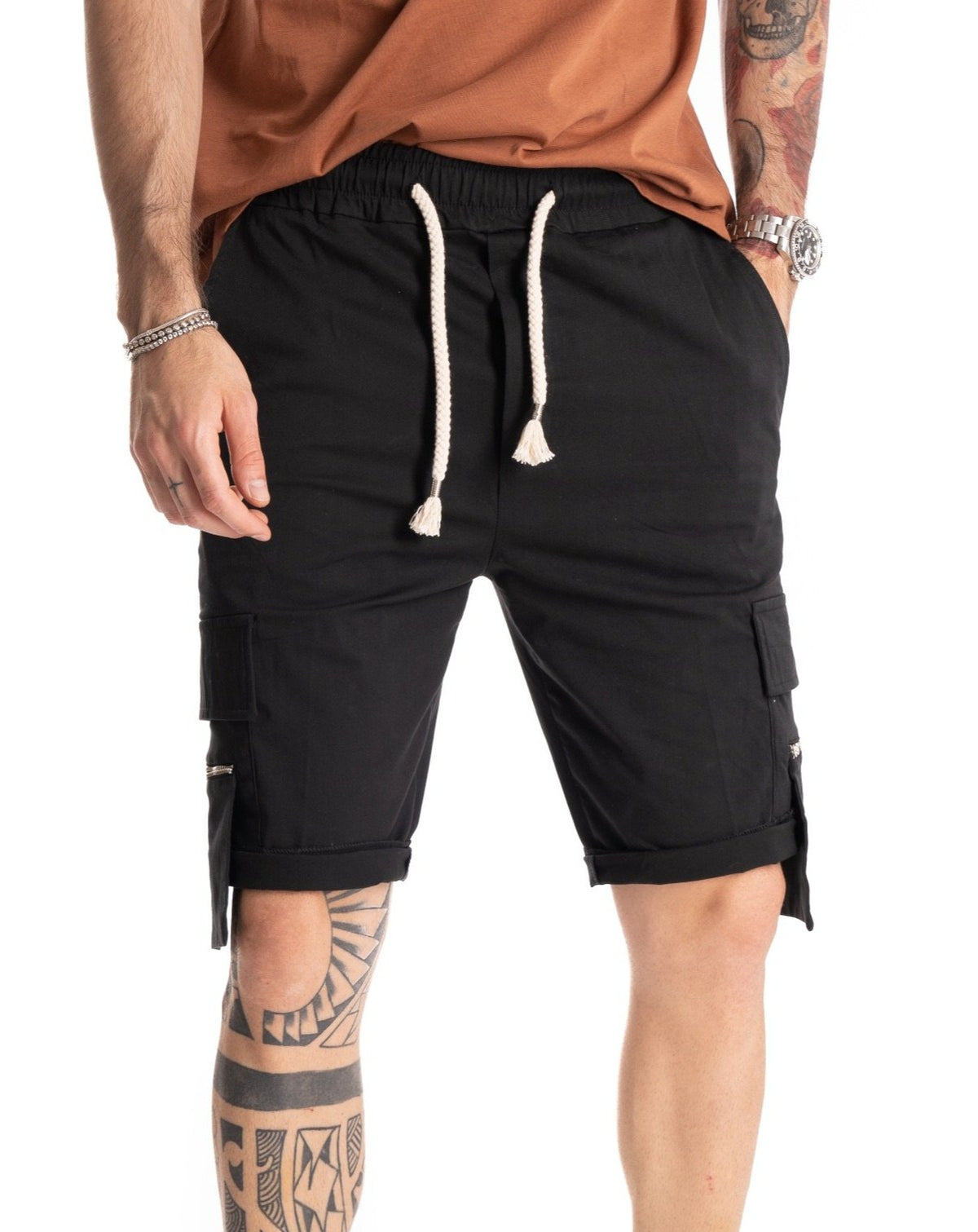 Black cargo shorts with elastic drawstring waistband, front view detail