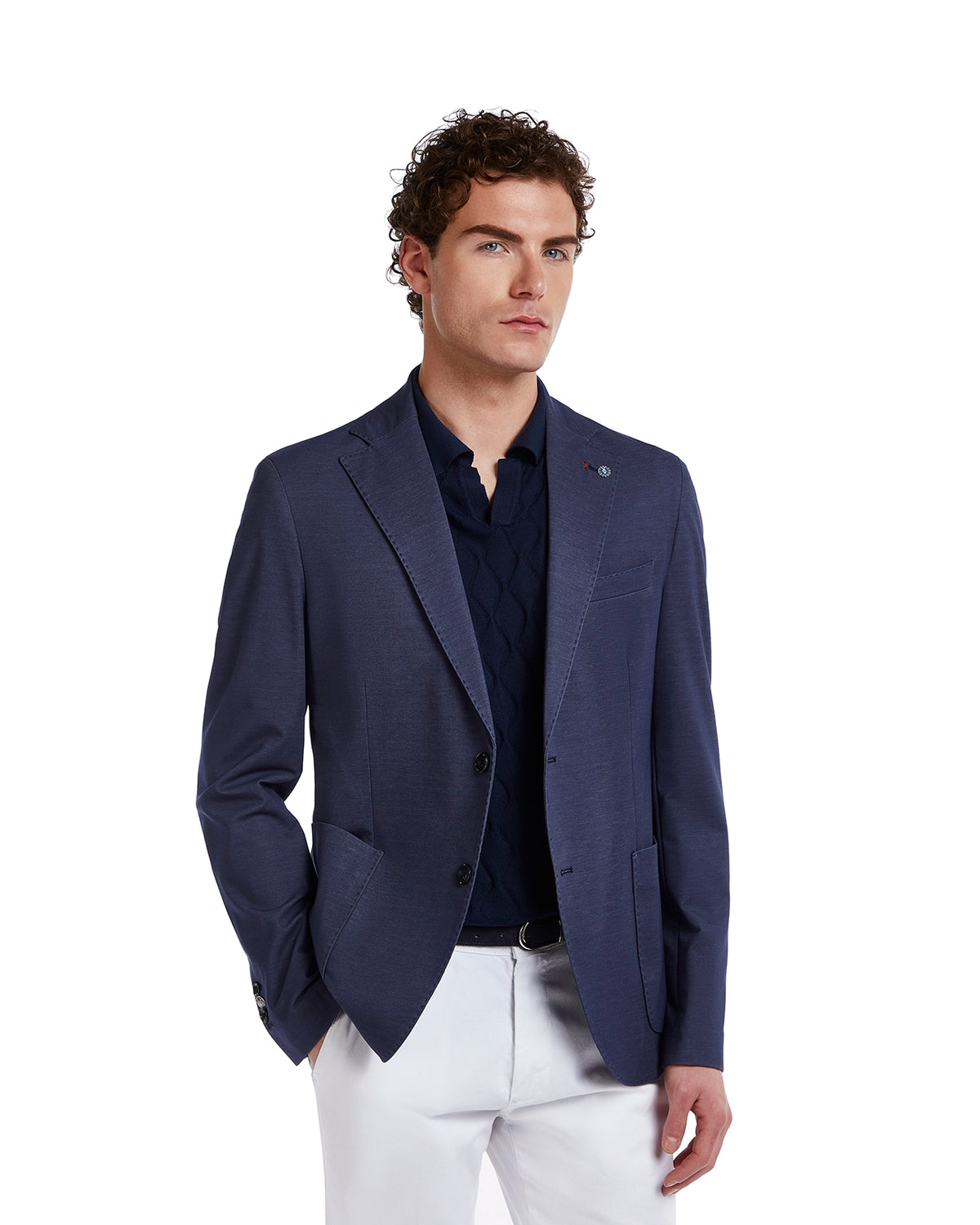 Navy blue tailored blazer in lightweight fabric, featuring two front pockets and a sleek design, paired with a navy sweater.