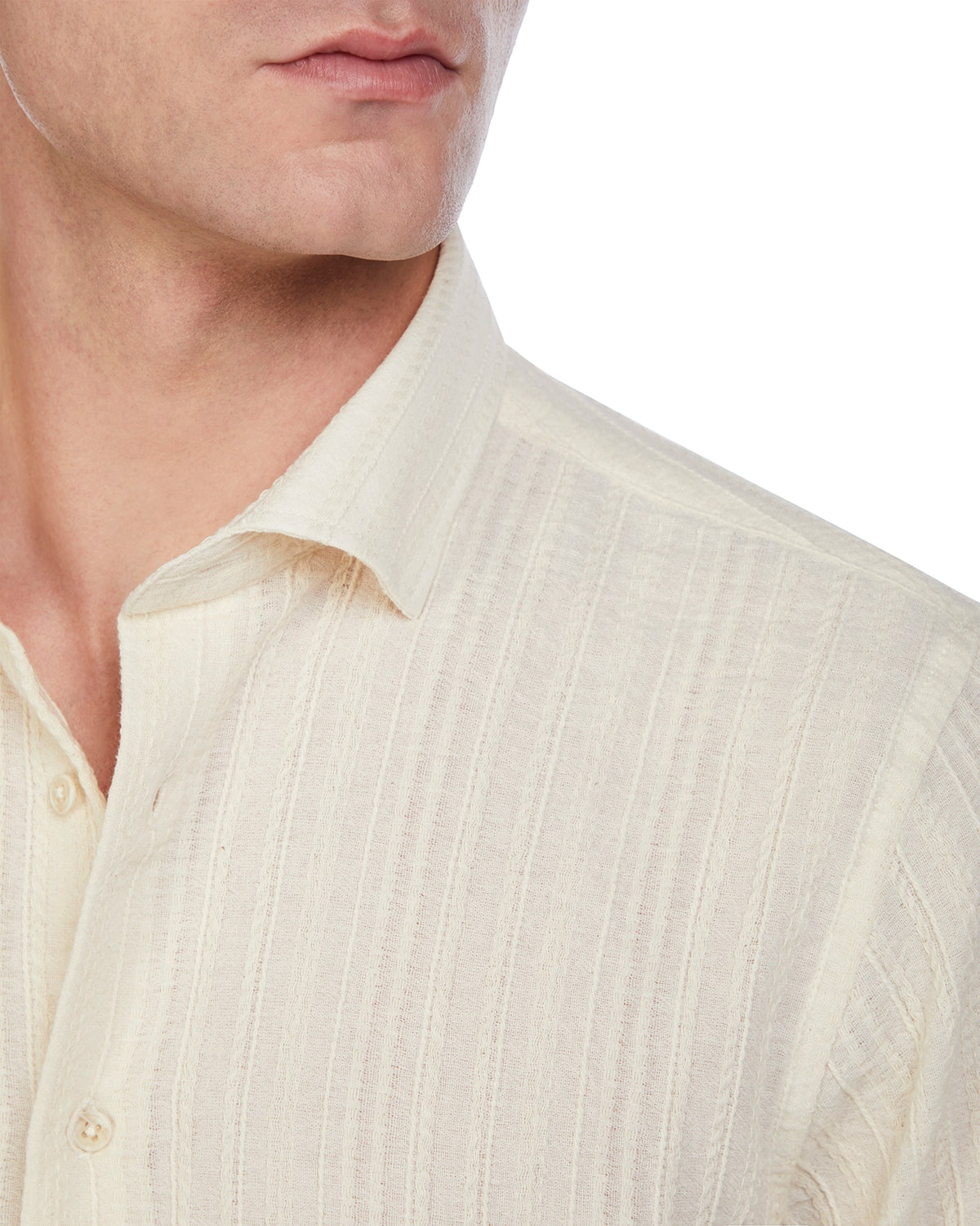 Cream textured button-up shirt in lightweight fabric, featuring a classic collar and subtle vertical stripes.