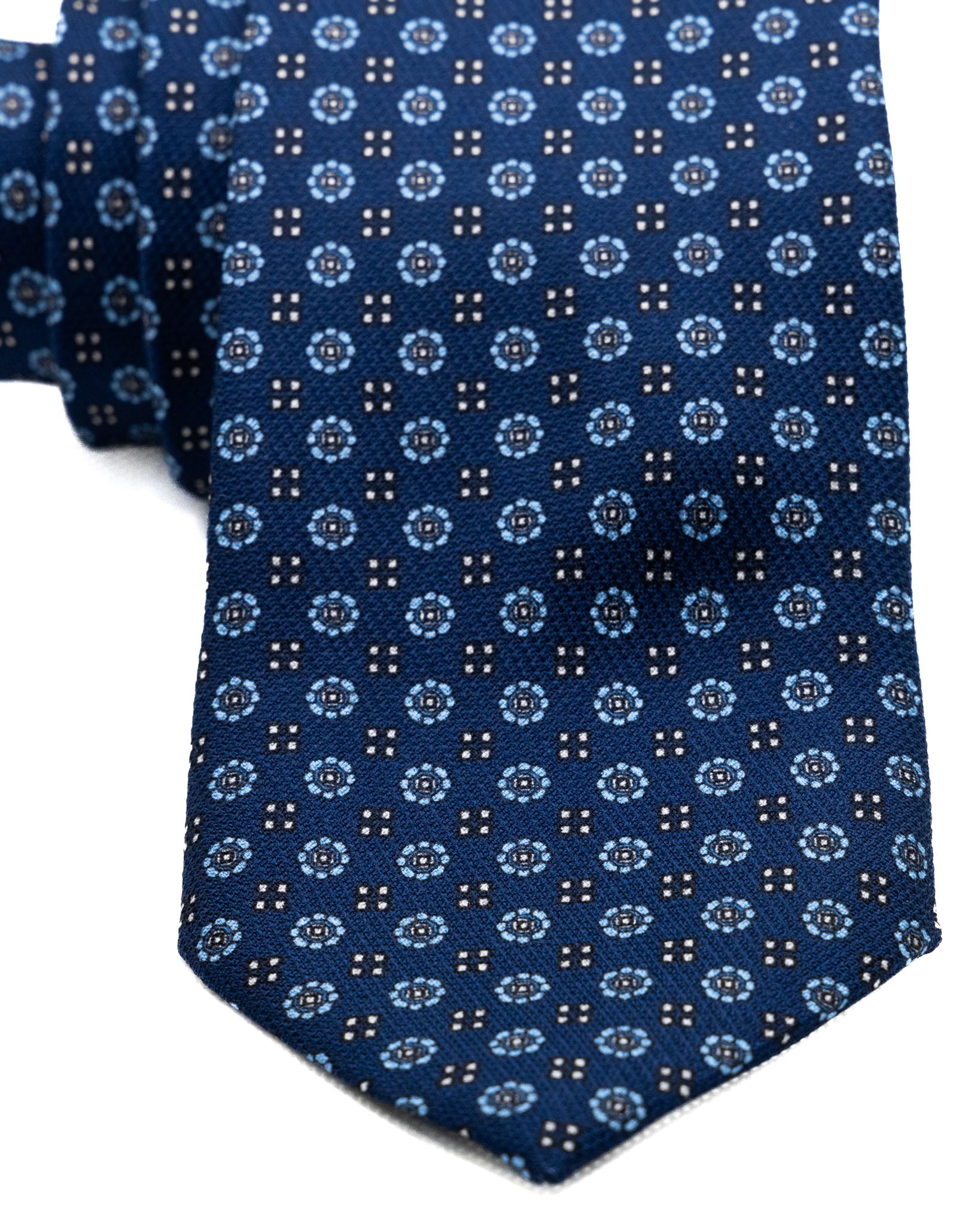 Tie - in blue silk with relief designs